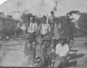 Searching for Kingsford Smith. Aboriginal tracker Wally Cameron middle front. Ca 1930s.