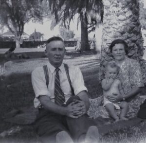 Powell Family 1 – David Henry Powell, Eva Powell (nee Fish) and Gwendolyn Powell sitting on knee. Circa 1949.