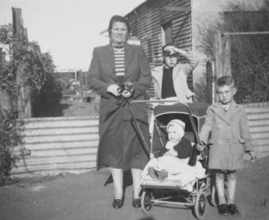 Powell Family- Left to Right- Eva Powell (nee Fish), Ellen Powell, Ronald Powell, Gwendolyn Powell in the pram. Circa -1947 to 1949.