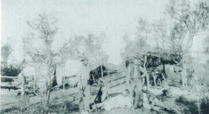 A goldfields camp – Willie Pearce is sitting on the right with his pipe. Supplied by Don Pearce