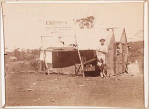 George Dainty stands outside his shop in Coolgardie in 1896