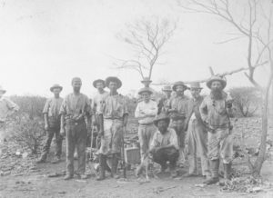Nannine miners farewell. Front L-R Unknown, J.C. Peterkin, W. Johnston ,crouching, Gillies Macpherson (extreme right), 27 March 1895.