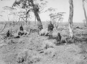Aboriginal tracker with policemen and prisoner.