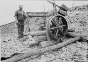 G.P. Ross pumping out water in King Solomon's Mine, Gullewa, G.P. Ross, 1930