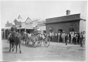 Gold Escort Leaving Bayley Street, Coolgardie - 1892, Hemus and Hall is next to the Union Bank.