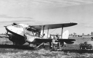 DH89 Dragon Rapide VH-AHI at Inverway Station, NT (near WA border) in 1955 which was one of the service stops where it overnighted. (Photo - Geoff Goodall)