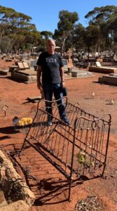Frank Zadcovich at the grave of his brother Allan Zadkovich