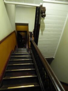 The steep and narrow staircase on the British Arms Hotel
