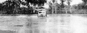 The Meekatharra overland mail truck Coming through the Flooded Nullagine River.