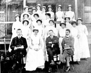 Kalgoorlie Western Argus - Tuesday 10 August 1909, page 22 GROUP, MEDICAL STAFF, NURSES, AND PROBATIONERS GOVERNMENT HOSPITAL. Front Row -Left to Right: Dr. Way, Resident Medical Officer; Mrs. Harvey, Matron; Dr. G. W. Barber, District Medical Officer; Mr. C. (M. F. Dwyer, photo) S. Tratman, Secretary.