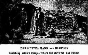 Detectives Mann and Sampson searching Wren's camp where the revolver was found.