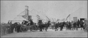 Escort loading gold in Coolgardie from the ‘Wealth of Nations’ Mine (circa 1894).
