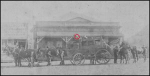 Arrival of a Gold Escort in Coolgardie - Cobb & Co Coach. Police officer next to driver in front is possibly Patrick Donovan.
