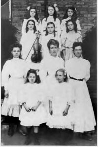 Group of music pupils from St. Anthony’s, 1907. Beatrice Fitzpatrick has been identified by family members as the student holding the violin. (Photo from: Anne McLay (1992), Women Out of Their Sphere, p. 217).