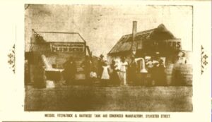 Messrs. Fitzpatrick & Hartness Tank and Condenser Manufactory, Sylvester Street. (Photo: The Coolgardie Pioneer, 19 December, 1896). The Fitzpatrick and Hartness families and staff are standing in front of water tanks at the site of the plumbing business.