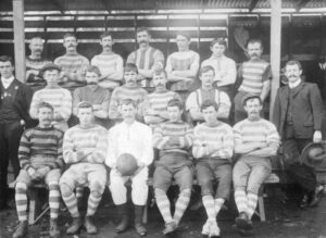 Greenbushes Australian football team portrait, Winfield in the front row, left-hand side, ca. 1905 - Photo SLWA