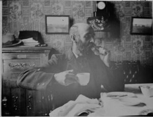 Elphinstone Cleland taking tea at home in Coolgardie