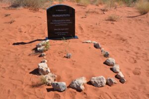 Mungkututu's Headstone, its located near Tobin's. However, Mungktutu wasn't buried there. Canning, when giving evidence to the Royal Commission to Inquire into the Treatment of Natives by the Canning Exploration party said he was buried that evening 1½ -2 miles away on a large sand ridge, slightly north of west from the well.