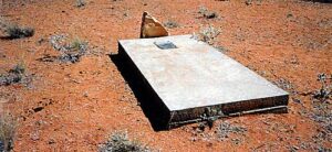 Ledger with bronze plaques and the remains of the original headstone at Abercrombie Well - Photo Find a Grave