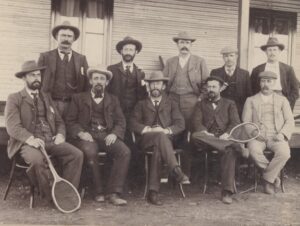 Official staff of the East Murchison United Gold Mine, Lawlers 1899 - 2nd from the left inj the back row is Charles C. Zenner - I wonder why they have tennis rackets?